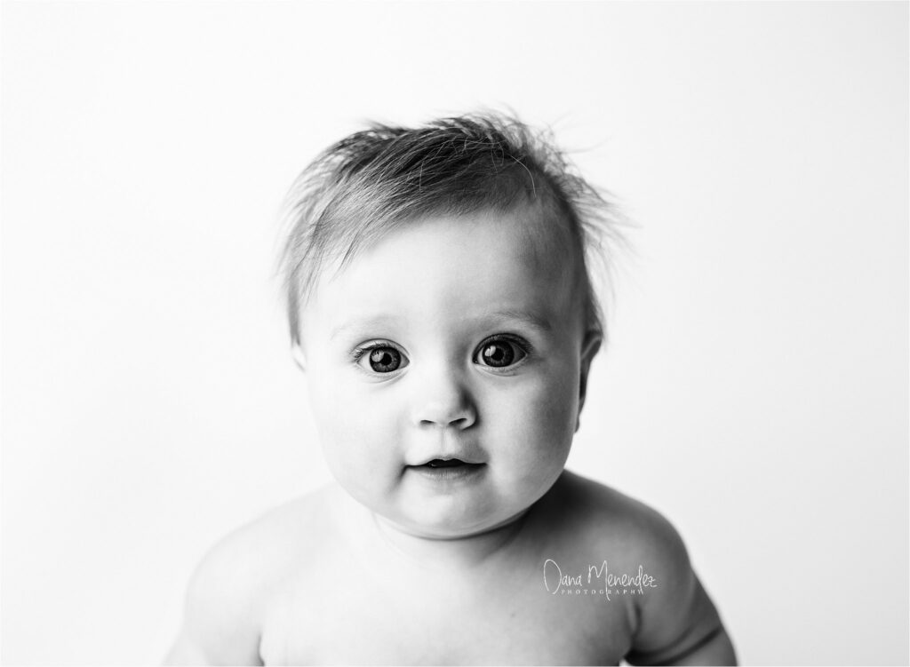 Baby girl portrait in black and white, captured by Dana Menendez newborn photographer.
