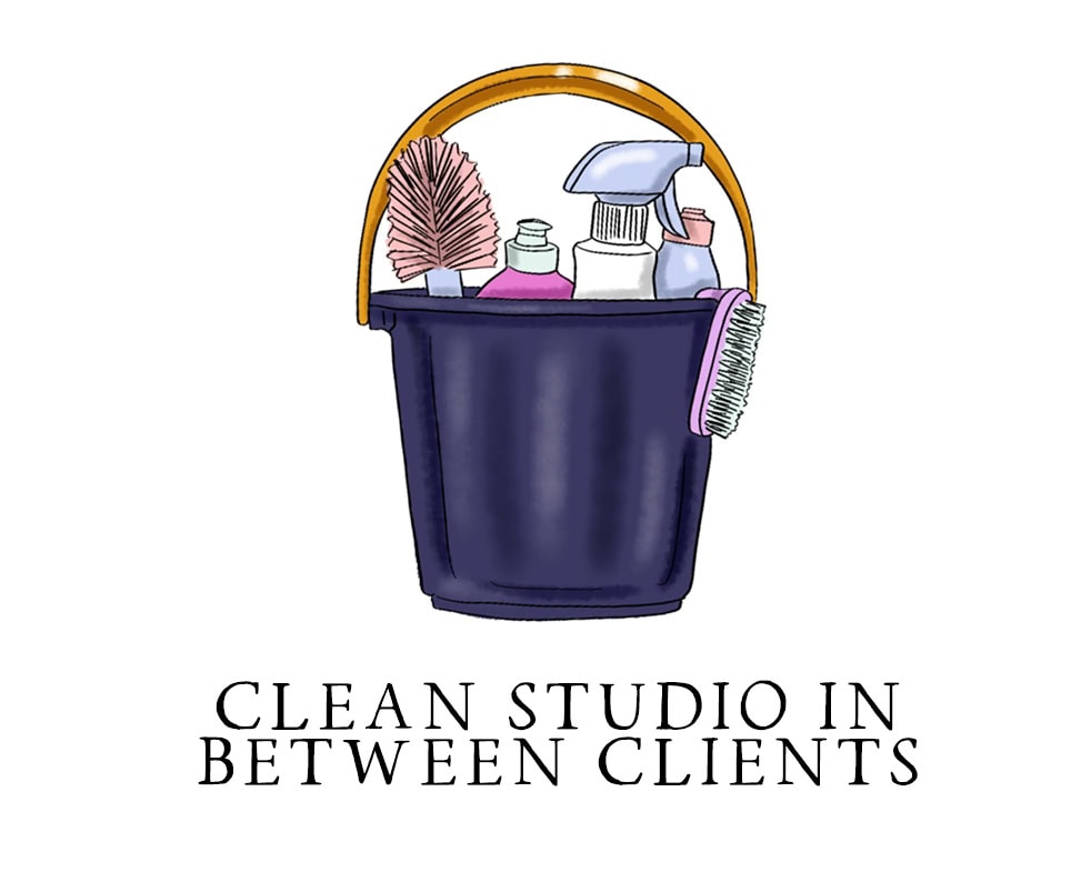 Organized cleaning bucket with supplies for a professional studio.