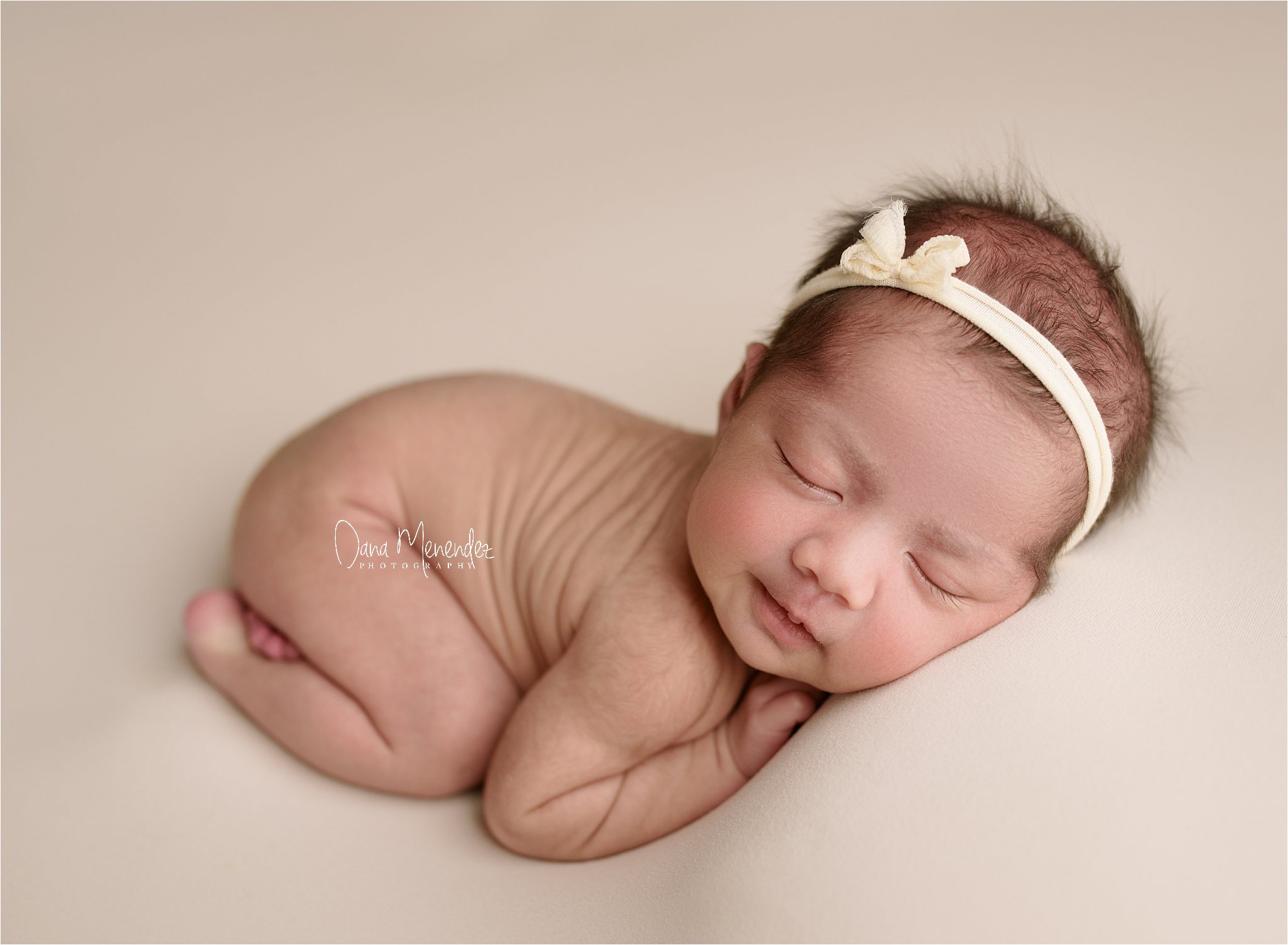 Baby Maggie sleeping peacefully during her infant portrait session in Okotoks, AB.